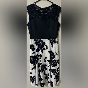 Homeyee black top with black and white floral skirt.  Size small.